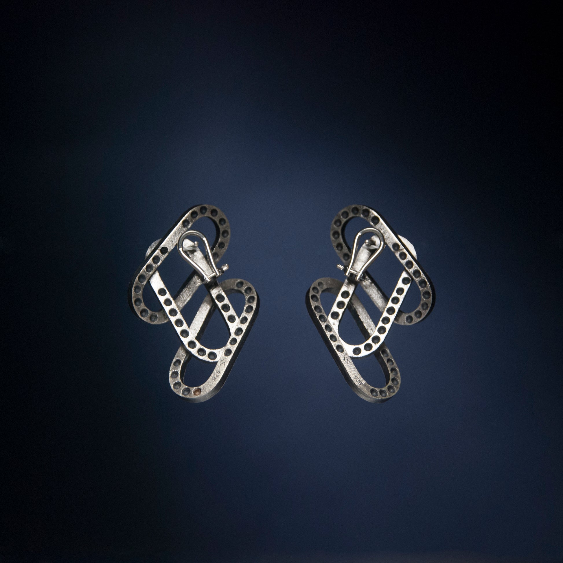 Rene Moreta. Jewelry, craftsmanship, design. Handcrafted silver earrings made locally in small batches in Puerto Rico.