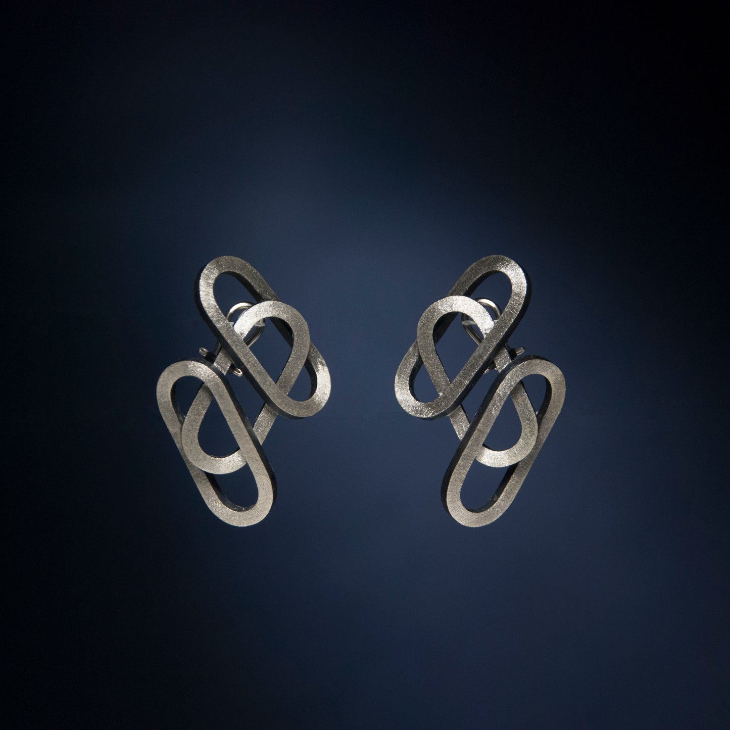 Rene Moreta. Jewelry, craftsmanship, design. Handcrafted silver earrings made locally in small batches in Puerto Rico.