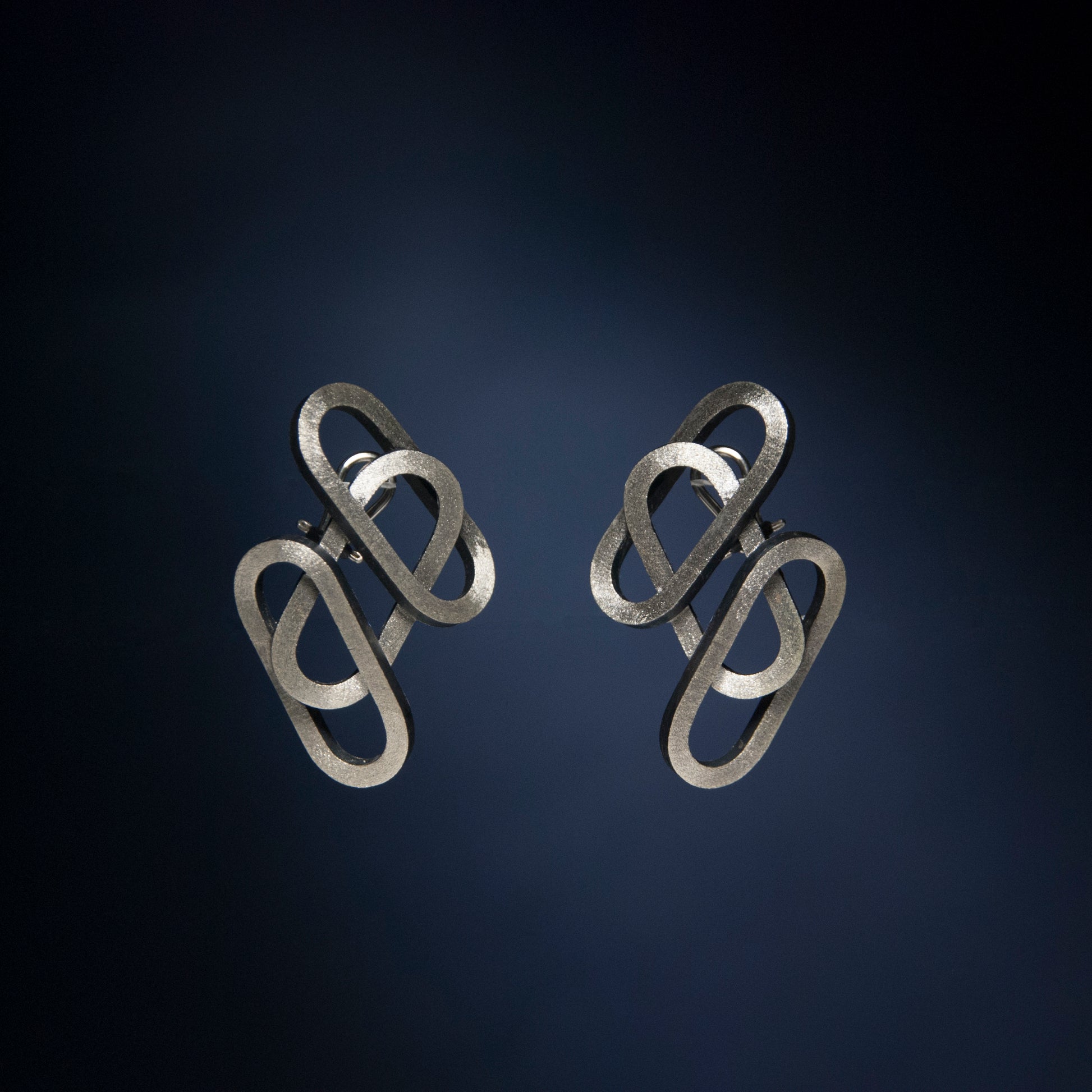 Rene Moreta. Jewelry, craftsmanship, design. Handcrafted silver earrings made locally in small batches in Puerto Rico.